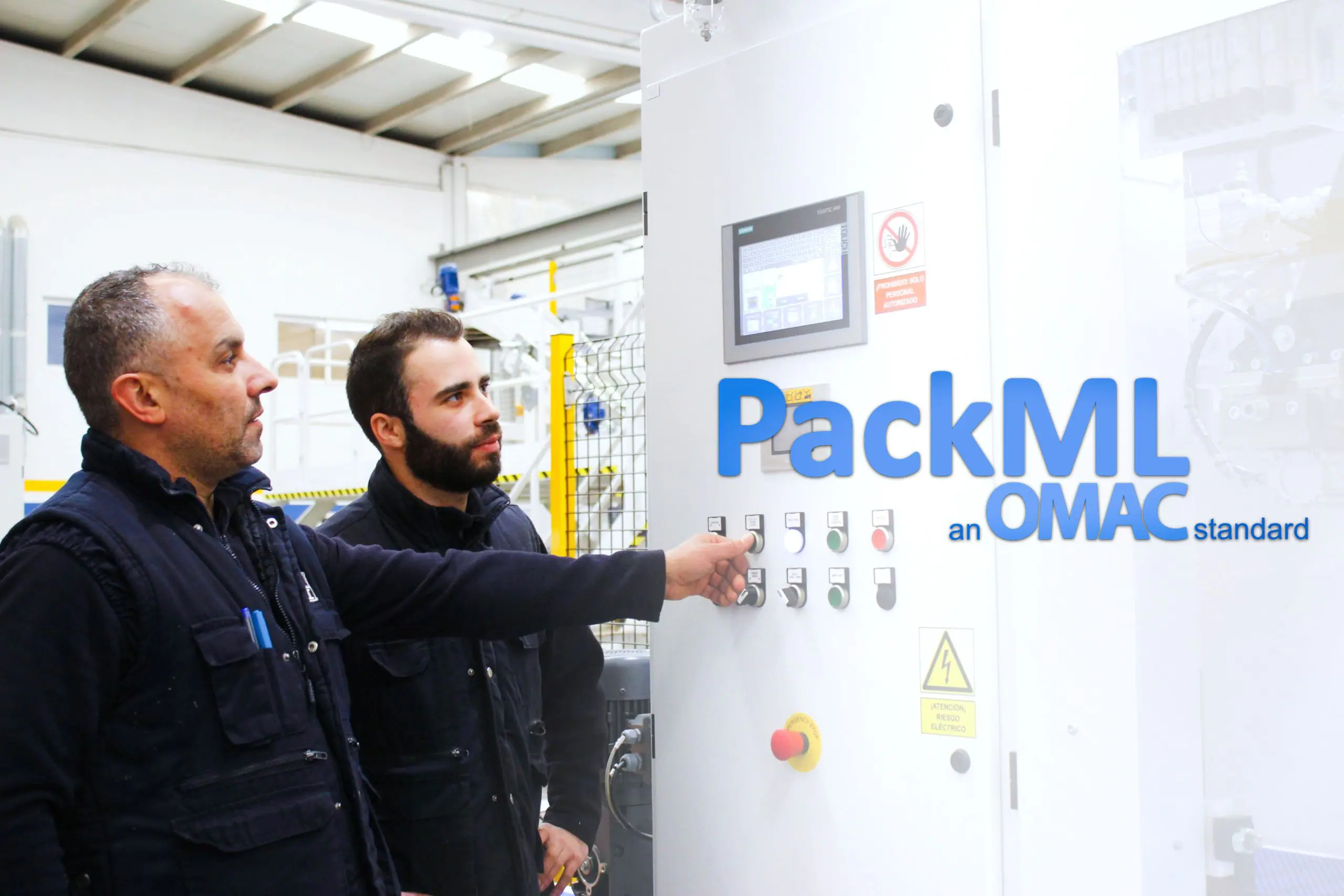 Engineers operating packaging control panel using PACKML standard to improve machine integration and efficiency in production line